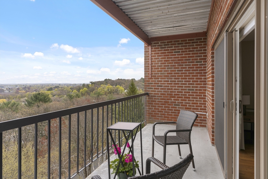 3 Summit Drive, Unit 67 Reading, MA 01867 - Photo 5 of 17 a view of a balcony with furniture