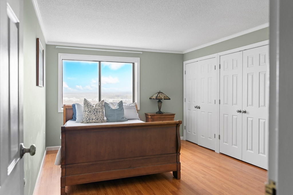 3 Summit Drive, Unit 67 Reading, MA 01867 - Photo 9 of 17 a view of room with furniture and wooden floor