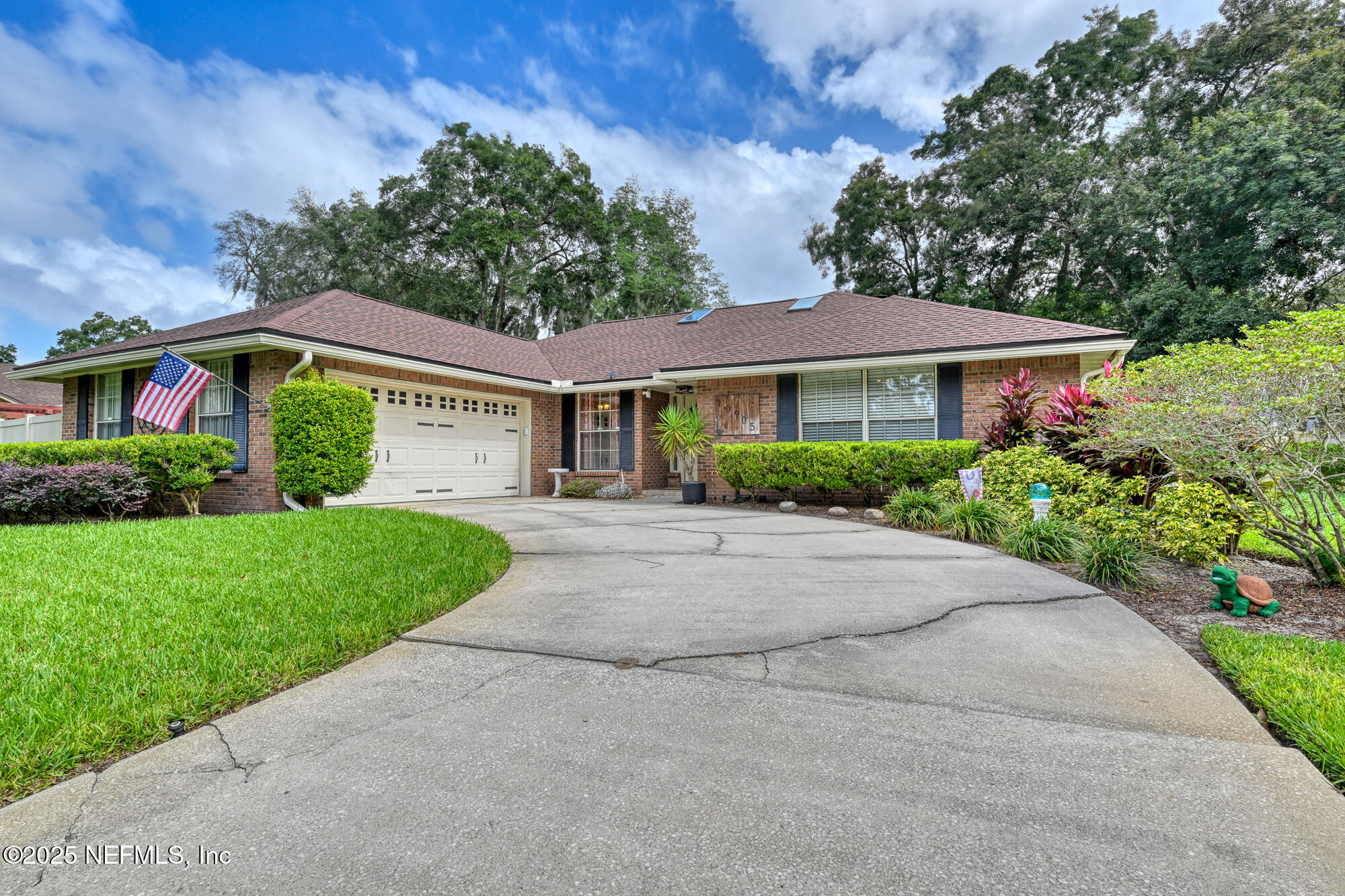 10905 Brentfield Road Jacksonville, FL 32225 - Photo 1 of 36 a front view of a house with a yard and green space