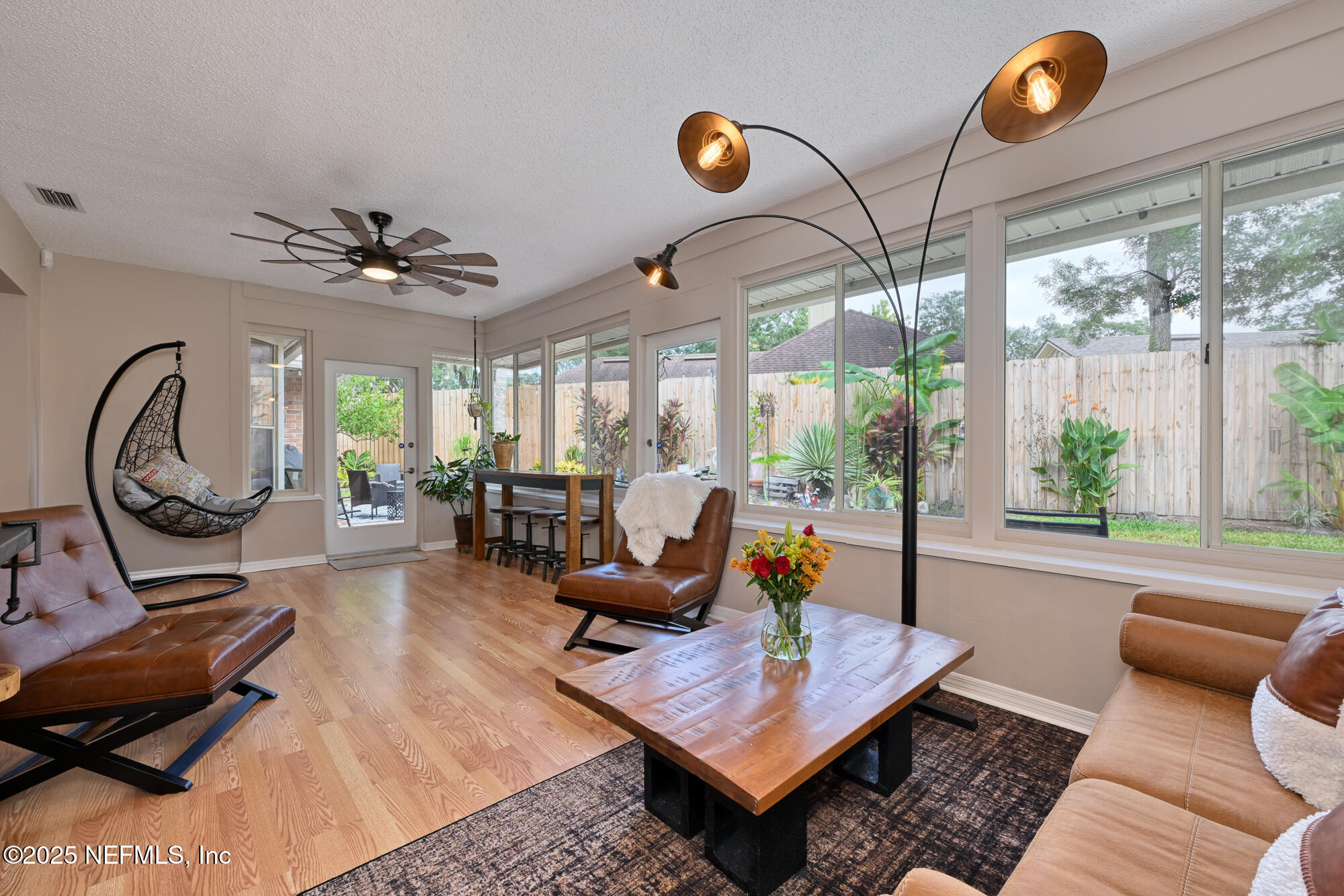 10905 Brentfield Road Jacksonville, FL 32225 - Photo 12 of 36 a living room with furniture a rug and a large window
