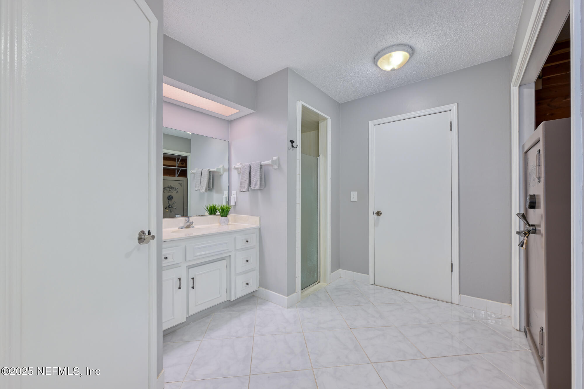 10905 Brentfield Road Jacksonville, FL 32225 - Photo 20 of 36 a bathroom with a sink and a mirror