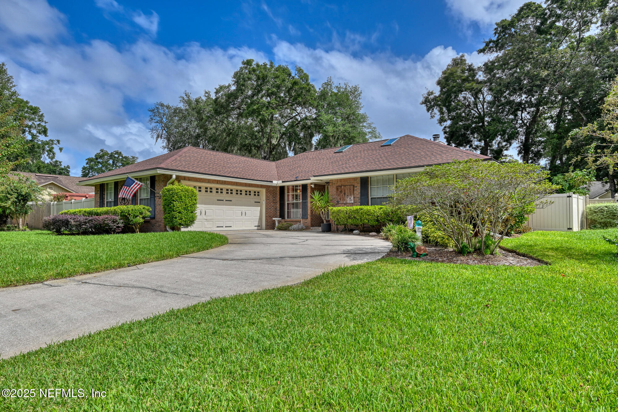 10905 Brentfield Road Jacksonville, FL 32225 - Photo 2 of 36 a front view of a house with a yard