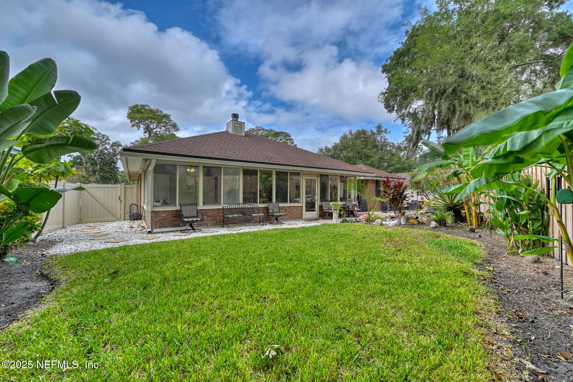 10905 Brentfield Road Jacksonville, FL 32225 - Photo 28 of 36 a front view of a house with swimming pool and porch with furniture