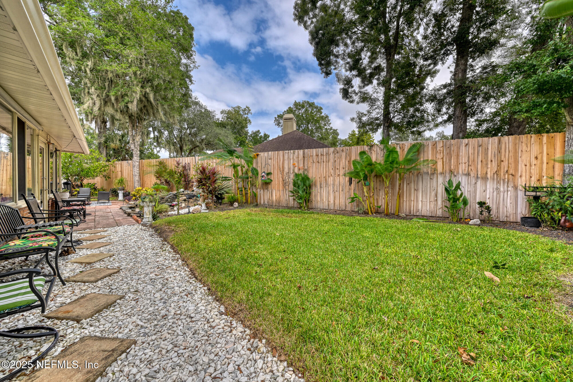 10905 Brentfield Road Jacksonville, FL 32225 - Photo 29 of 36 a view of a backyard with sitting area