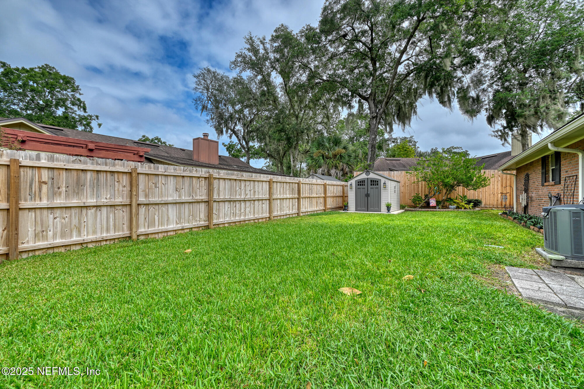 10905 Brentfield Road Jacksonville, FL 32225 - Photo 36 of 36 a view of a backyard with a garden