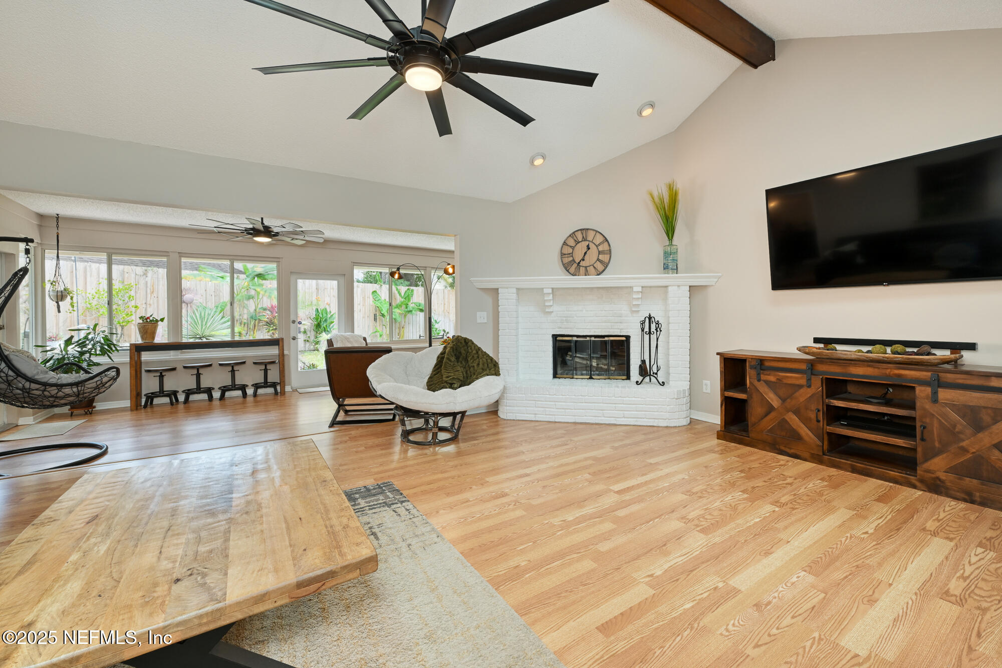10905 Brentfield Road Jacksonville, FL 32225 - Photo 8 of 36 a living room with furniture and a flat screen tv