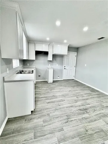 a view of kitchen with wooden floor