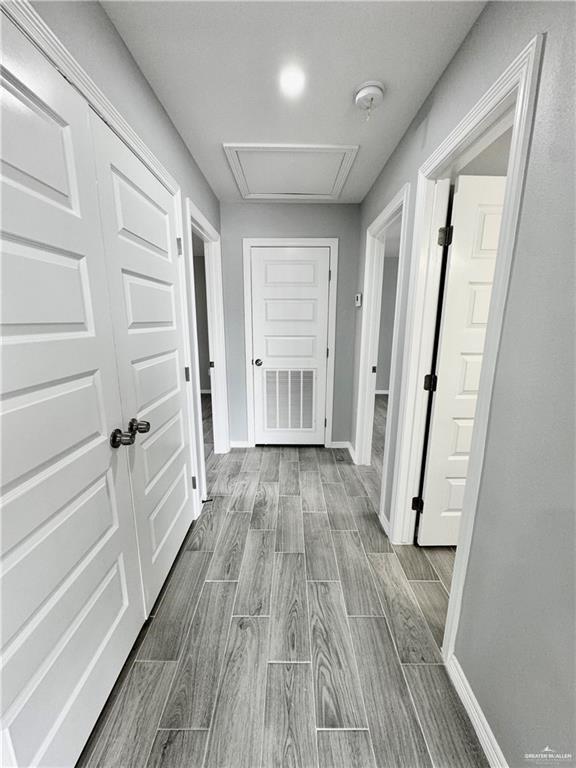 436 East Acacia Avenue, Unit 1 Alamo, TX 78516 - Photo 6 of 11 a view of a hallway with wooden floor and staircase