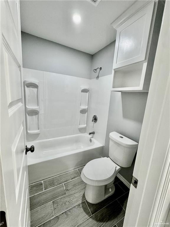 436 East Acacia Avenue, Unit 1 Alamo, TX 78516 - Photo 8 of 11 a bathroom with a toilet and a shower