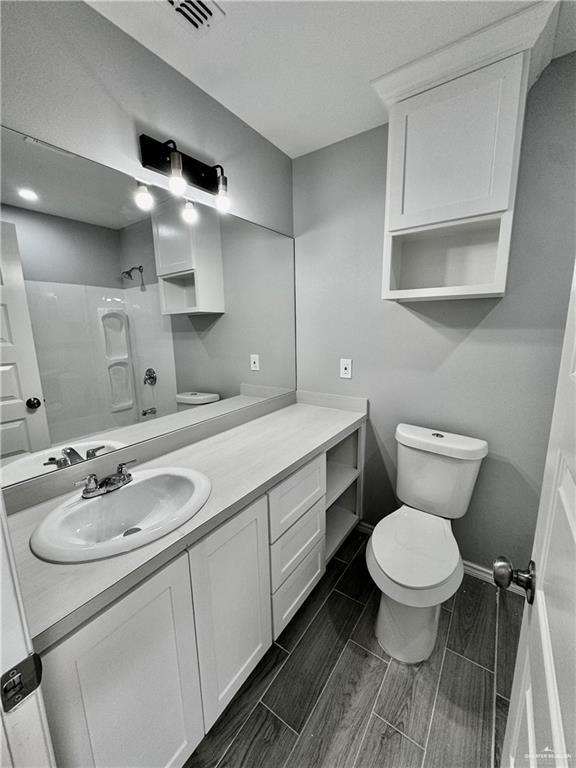 436 East Acacia Avenue, Unit 1 Alamo, TX 78516 - Photo 10 of 11 a bathroom with a sink toilet and a mirror