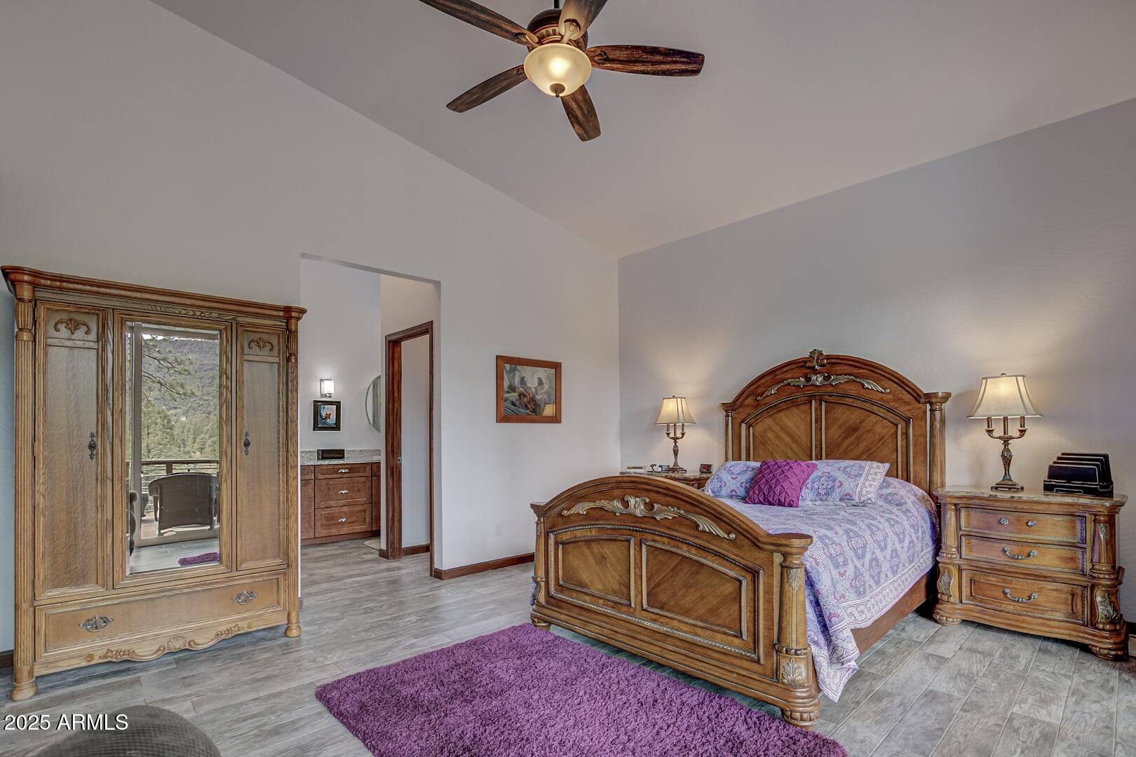 3465 Whispering Pines Road Pine, AZ 85544 - Photo 18 of 53 a bedroom with a bed and wooden floor