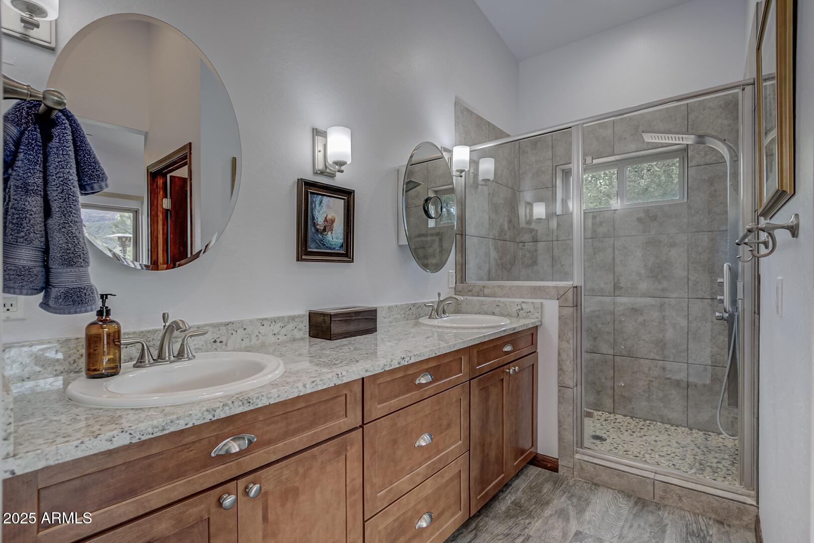 3465 Whispering Pines Road Pine, AZ 85544 - Photo 19 of 53 a bathroom with a granite countertop sink mirror and double
