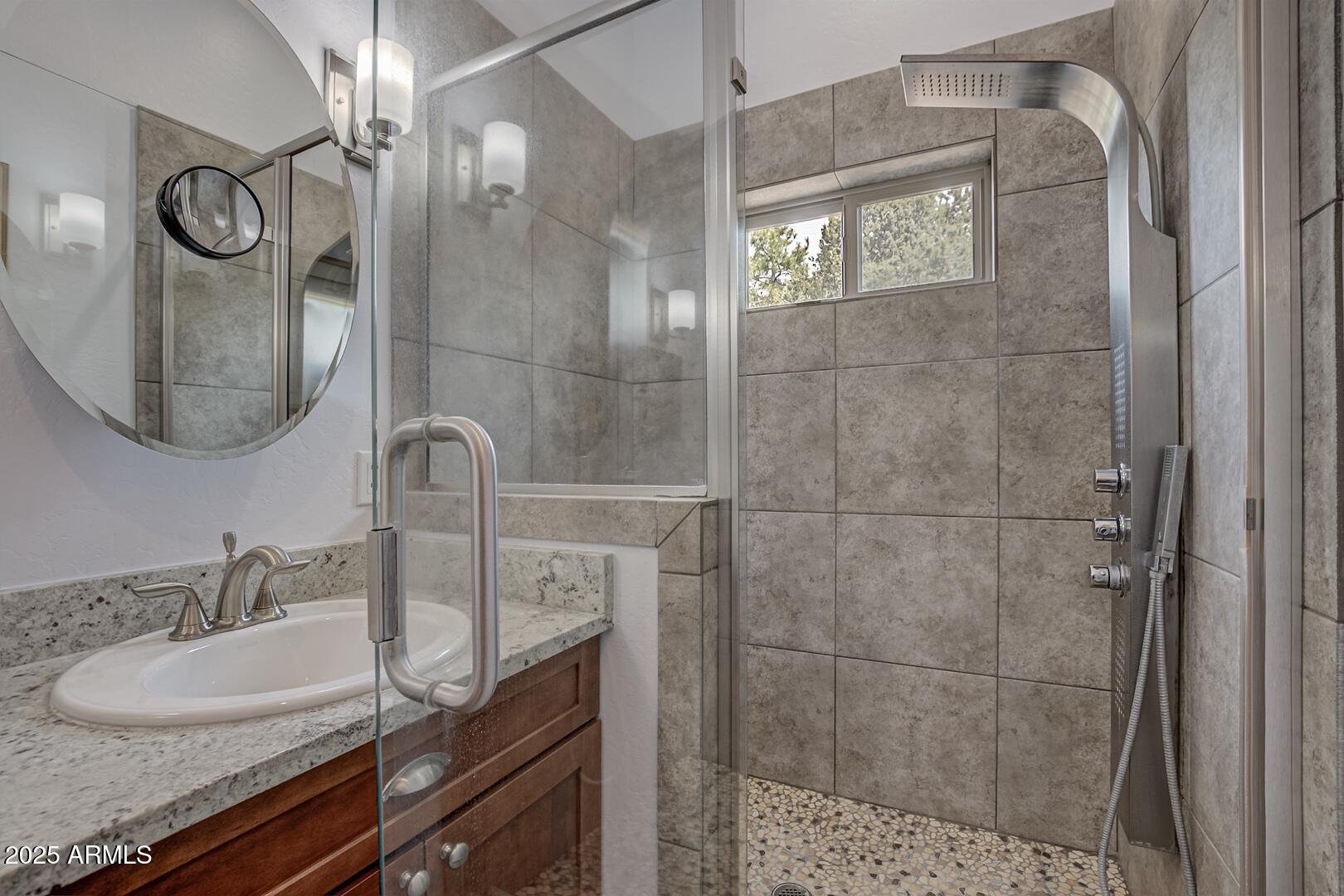 3465 Whispering Pines Road Pine, AZ 85544 - Photo 20 of 53 a bathroom with a sink and a mirror