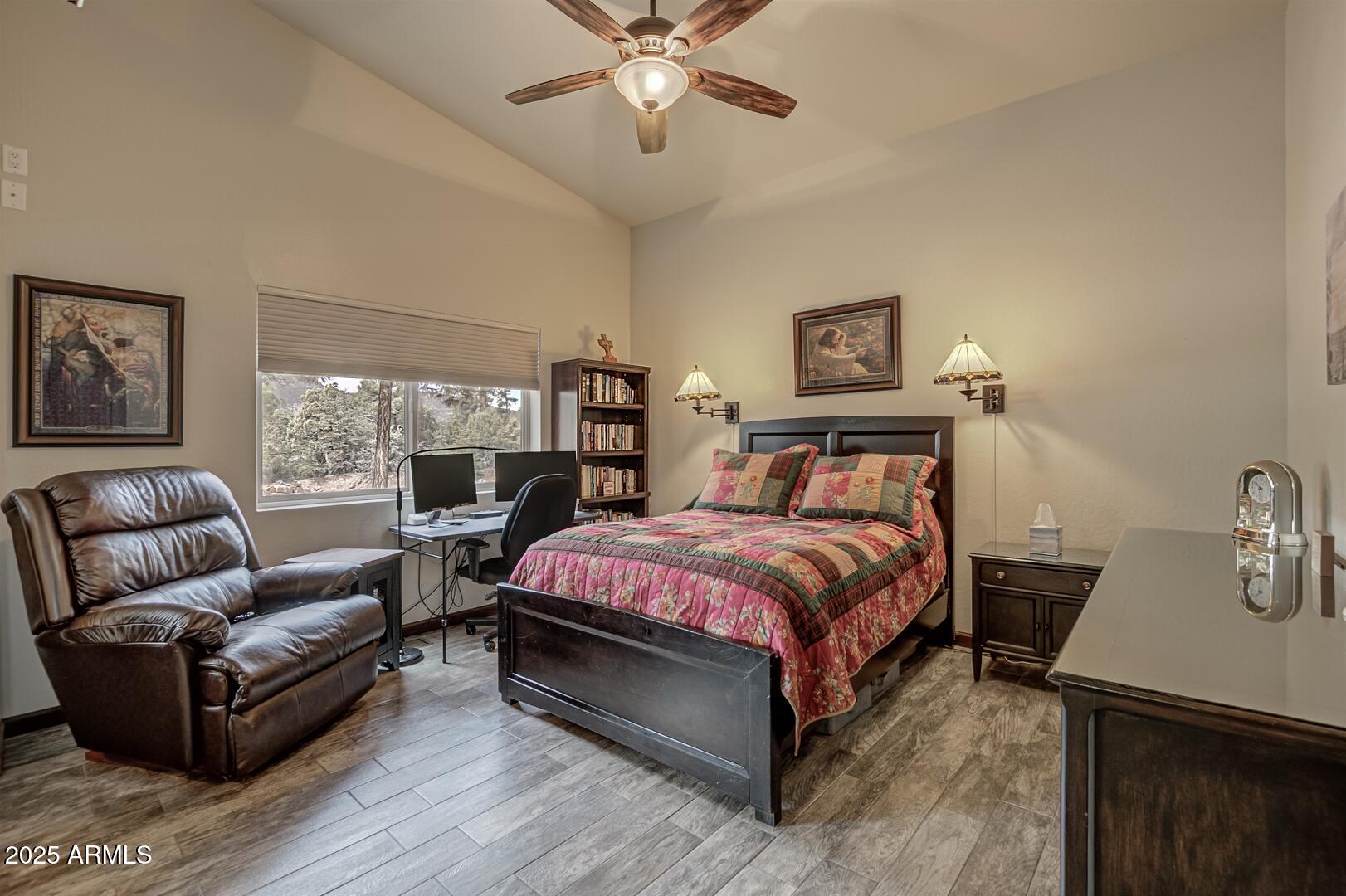 3465 Whispering Pines Road Pine, AZ 85544 - Photo 22 of 53 a spacious bedroom with a bed and a couch