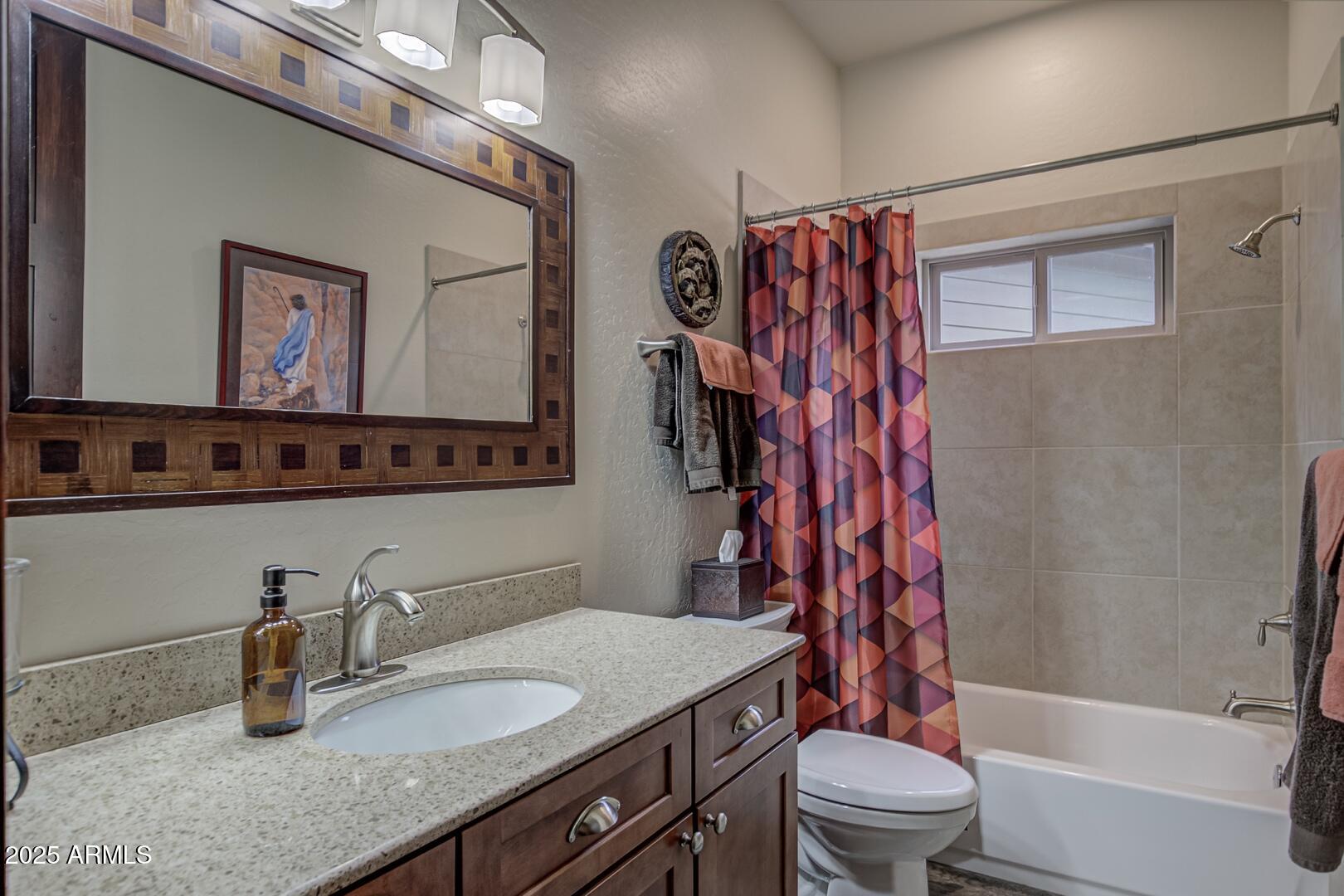 3465 Whispering Pines Road Pine, AZ 85544 - Photo 23 of 53 a bathroom with a granite countertop sink toilet and shower