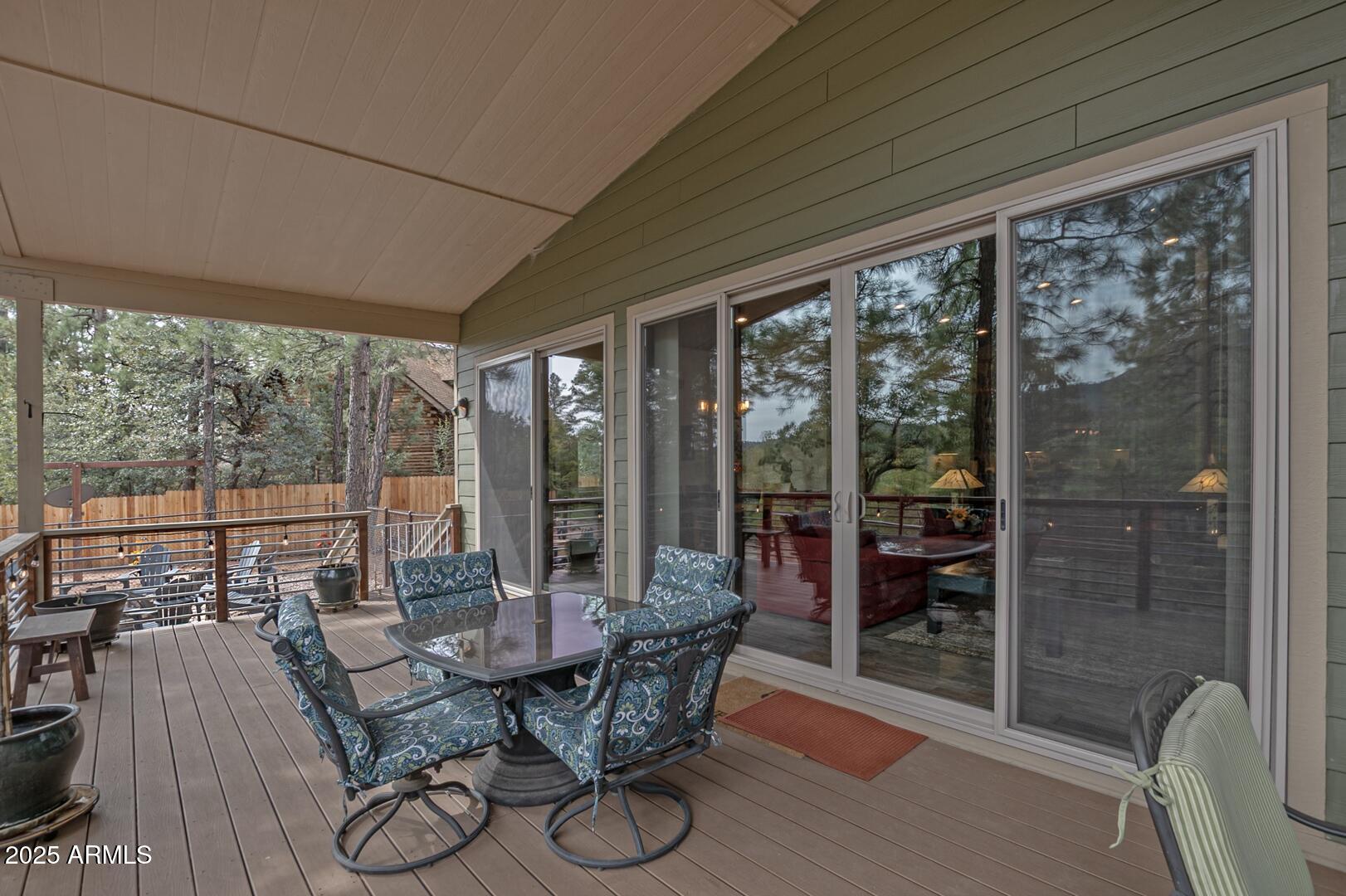 3465 Whispering Pines Road Pine, AZ 85544 - Photo 26 of 53 a view of a dining room with furniture window and outside view