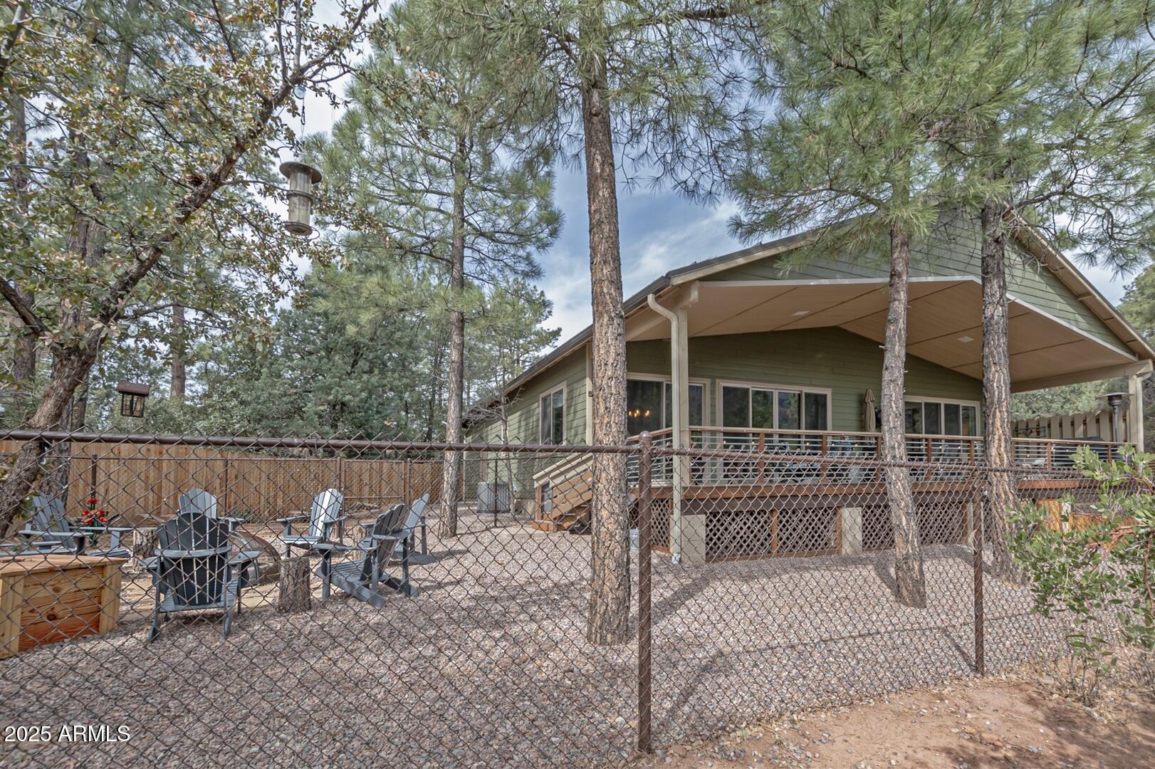 3465 Whispering Pines Road Pine, AZ 85544 - Photo 29 of 53 a view of a house with backyard and sitting area
