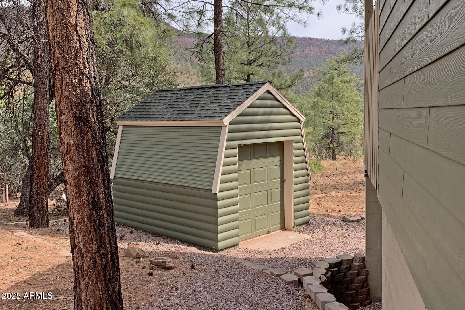 3465 Whispering Pines Road Pine, AZ 85544 - Photo 30 of 53 a front view of a house with a yard