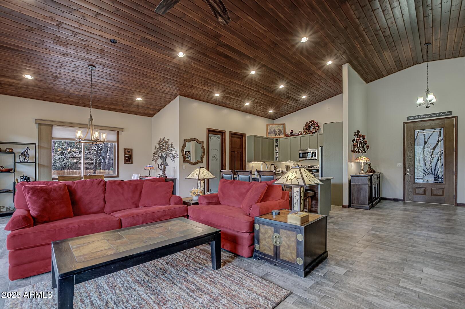 3465 Whispering Pines Road Pine, AZ 85544 - Photo 5 of 53 a living room with furniture and a wooden floor