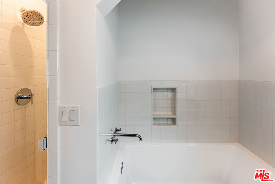 1253 South Rimpau Boulevard Los Angeles, CA 90019 - Photo 66 of 71 a bathroom with a shower
