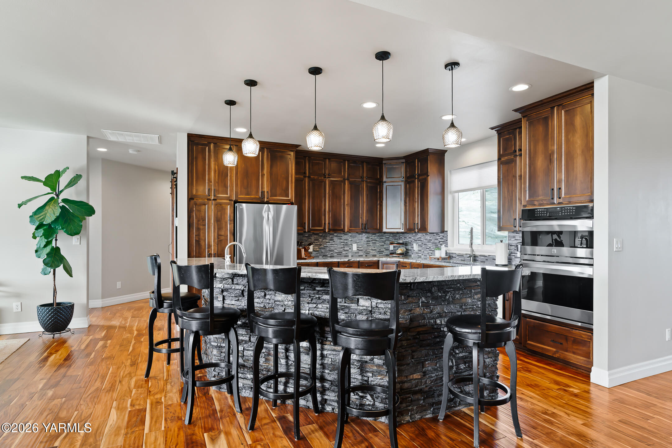 455 Rankin Road Selah, WA 98942 - Photo 11 of 57 a large kitchen with a table and chairs in it