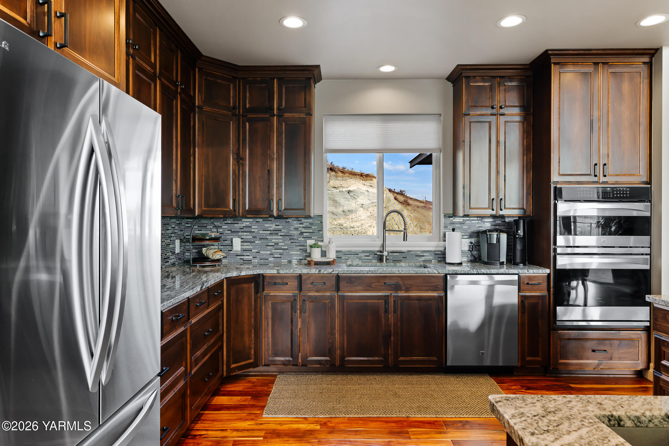 455 Rankin Road Selah, WA 98942 - Photo 14 of 57 a kitchen with stainless steel appliances granite countertop a refrigerator and a sink