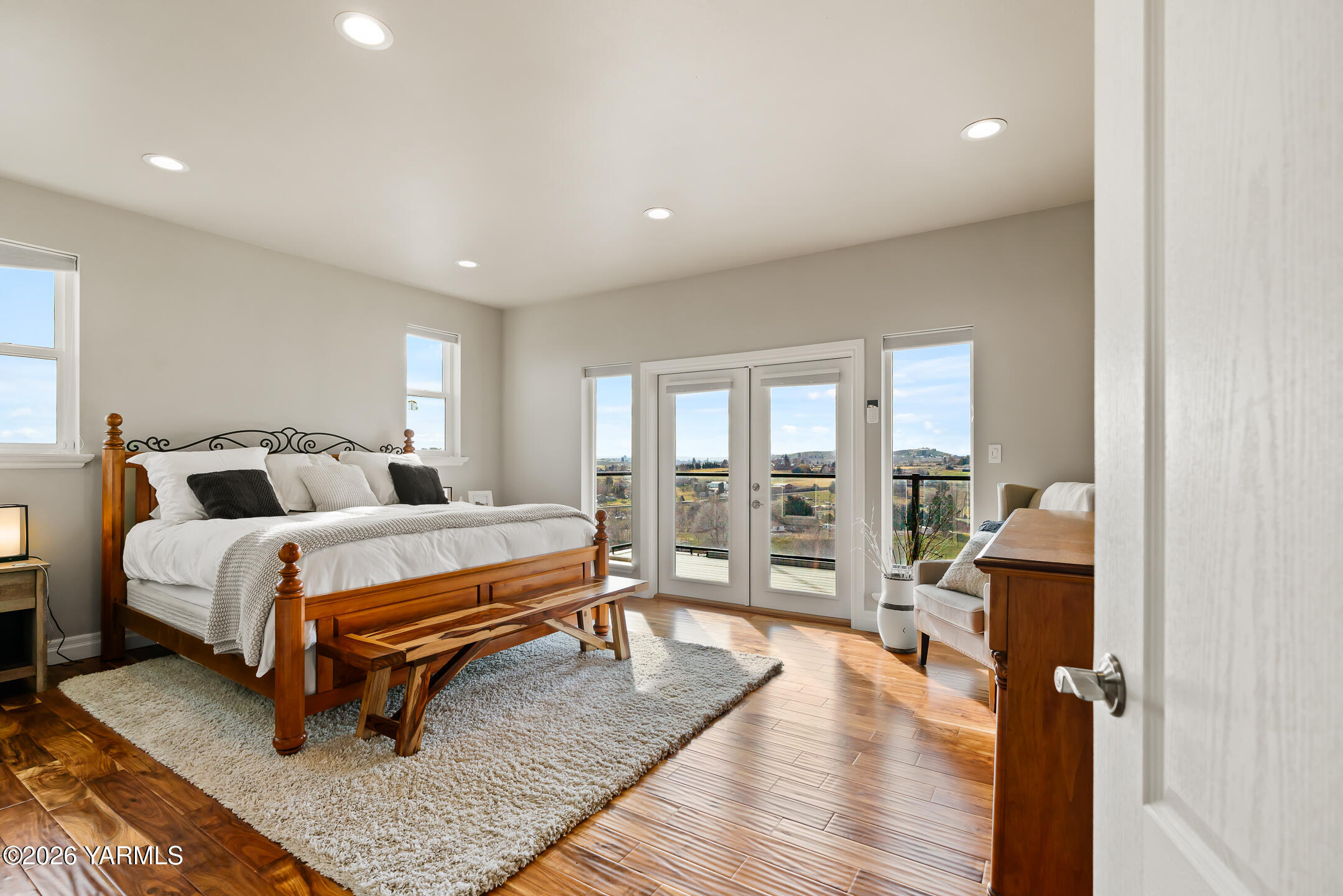 455 Rankin Road Selah, WA 98942 - Photo 17 of 57 a bedroom with furniture and a wooden floor