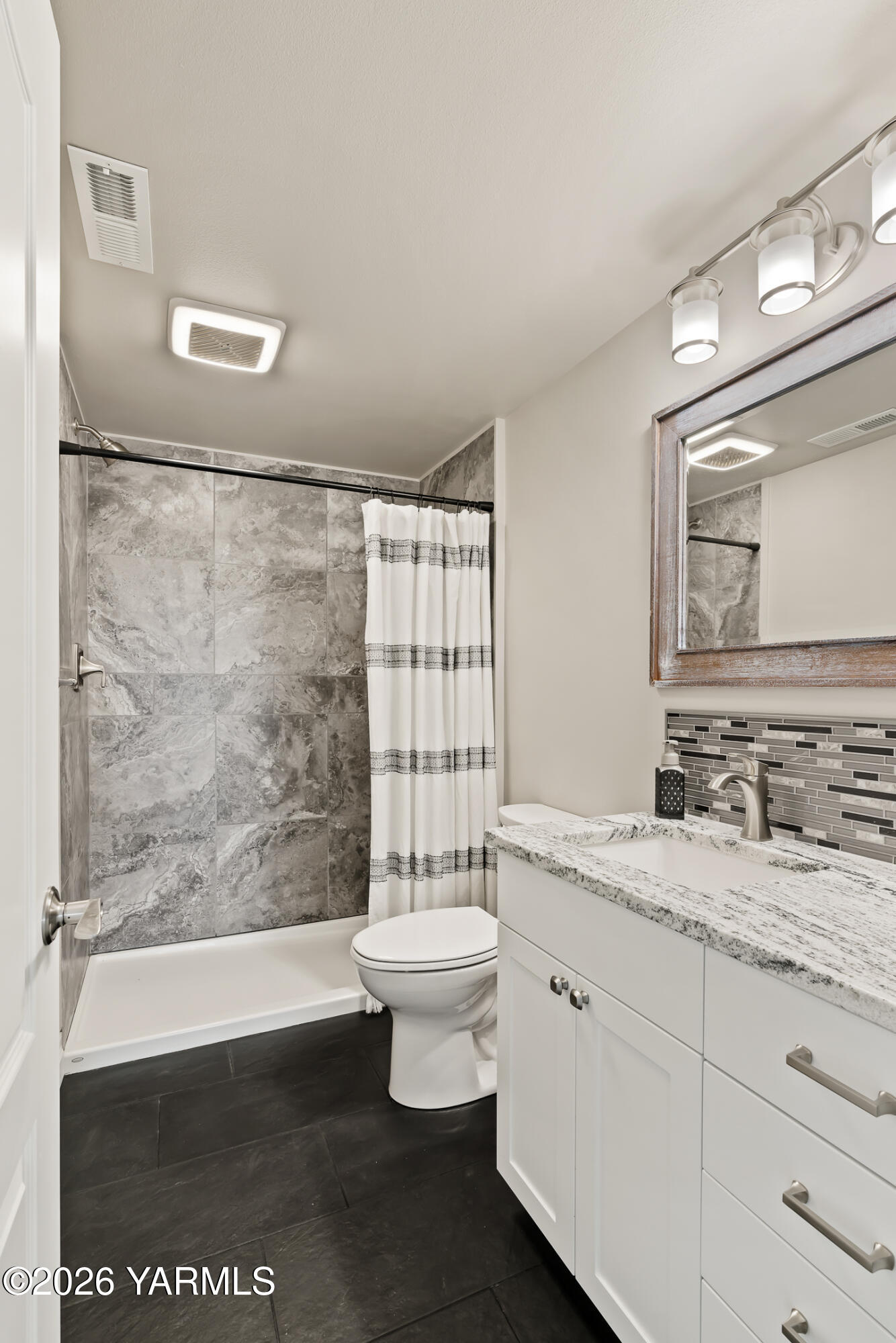 455 Rankin Road Selah, WA 98942 - Photo 31 of 57 a bathroom with a granite countertop sink toilet and mirror