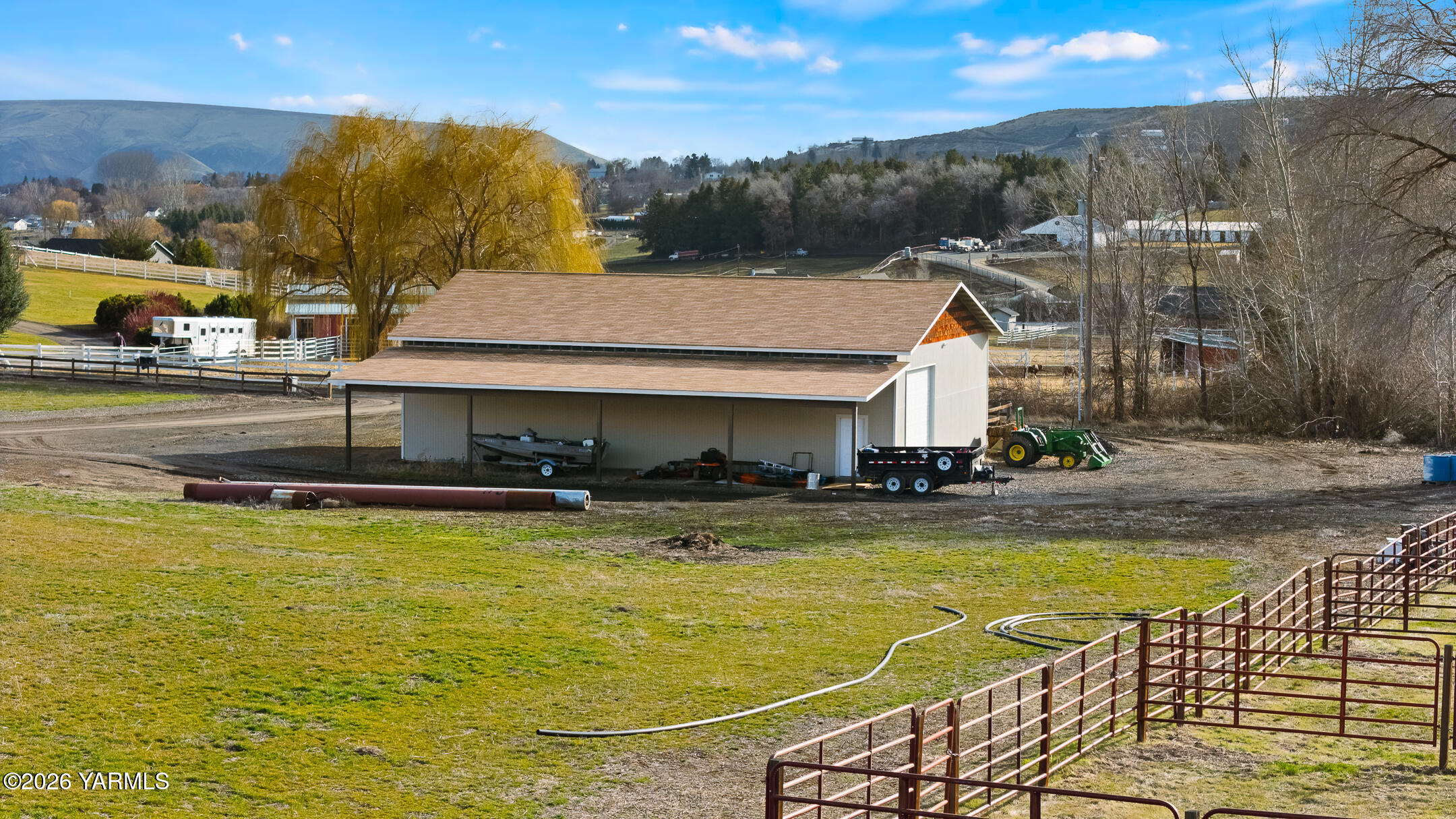 455 Rankin Road Selah, WA 98942 - Photo 43 of 57 a view of a swimming pool with a lawn chairs and floor to ceiling window