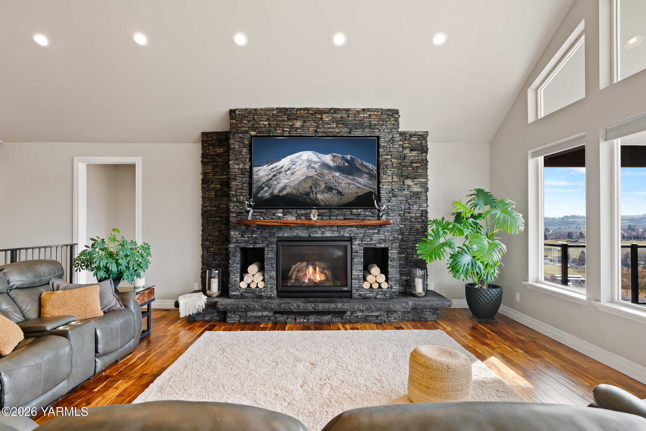 455 Rankin Road Selah, WA 98942 - Photo 5 of 57 a living room with furniture a potted plant and a fireplace