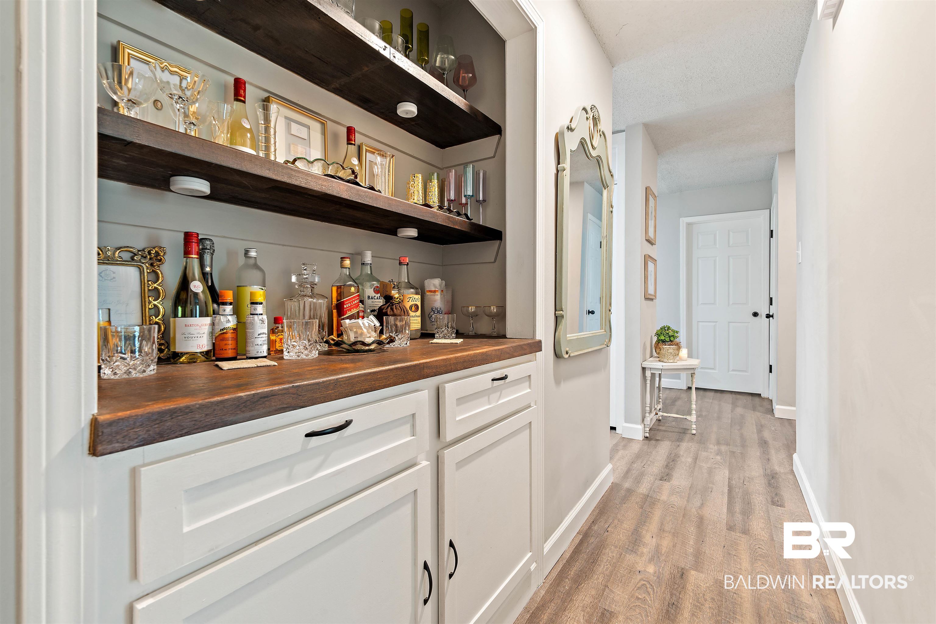 4682 Opal Drive Mobile, AL 36619 - Photo 21 of 27 Bar featuring white cabinets, light wood-type flooring, and wood counters
