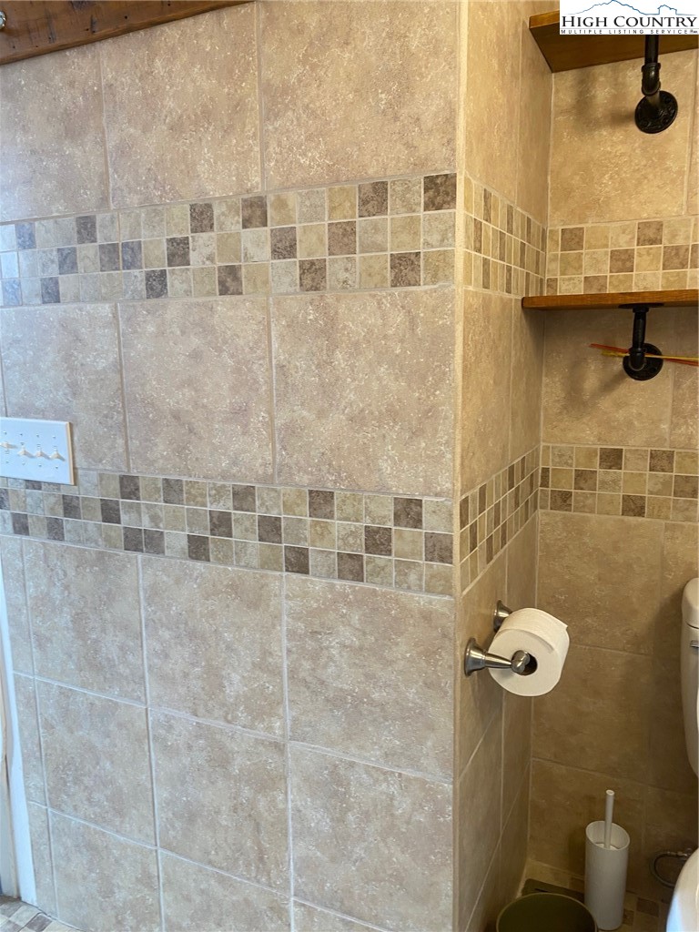 1345 Wagoner Ridge Road Ennice, NC 28623 - Photo 11 of 48 a bathroom with a shower