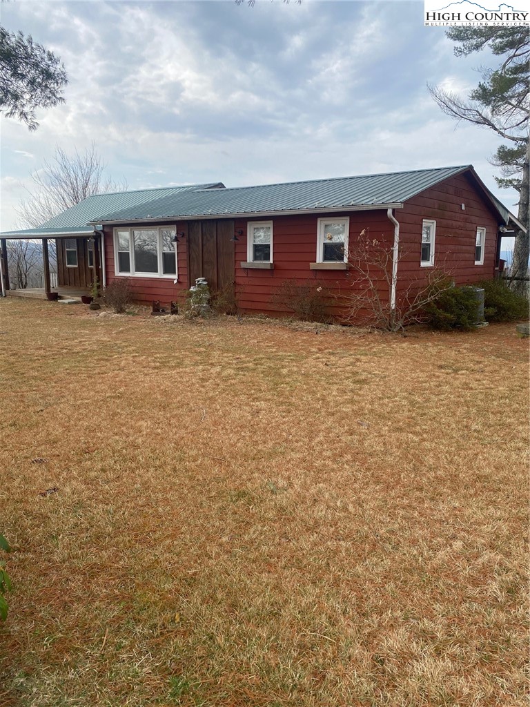 1345 Wagoner Ridge Road Ennice, NC 28623 - Photo 22 of 48 front view of a house with a big yard