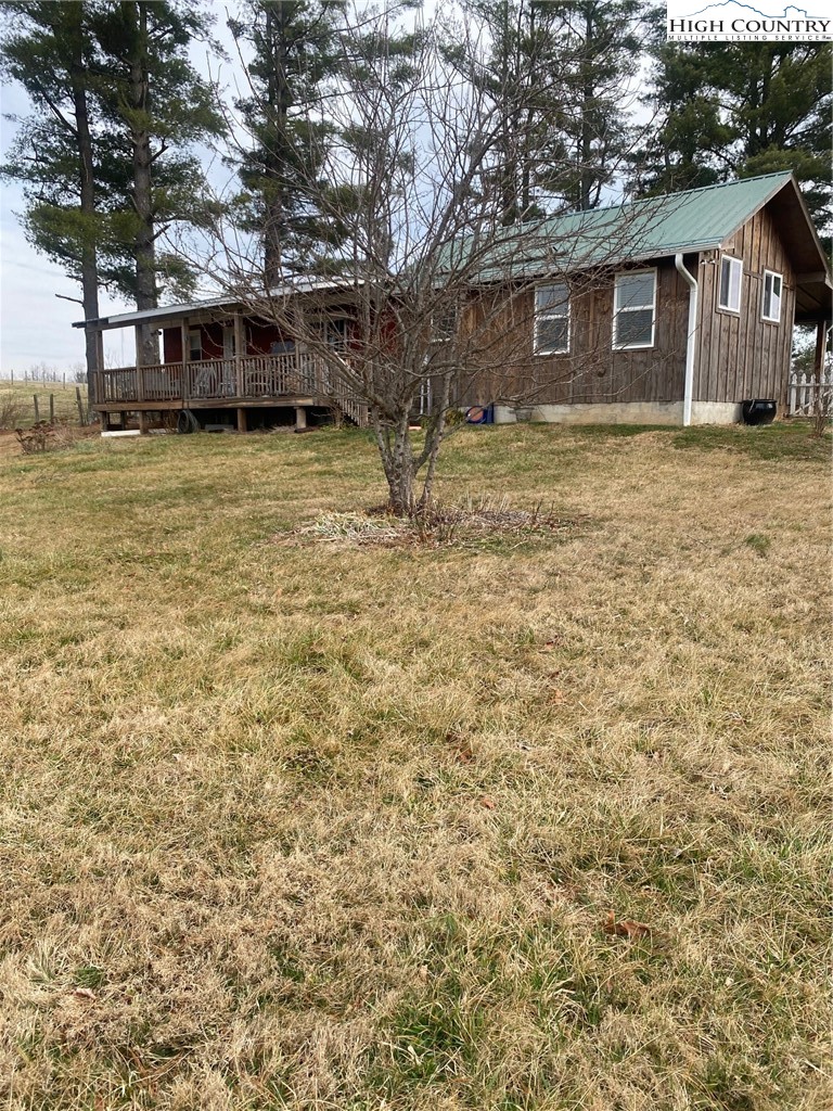 1345 Wagoner Ridge Road Ennice, NC 28623 - Photo 24 of 48 a view of a house with a yard