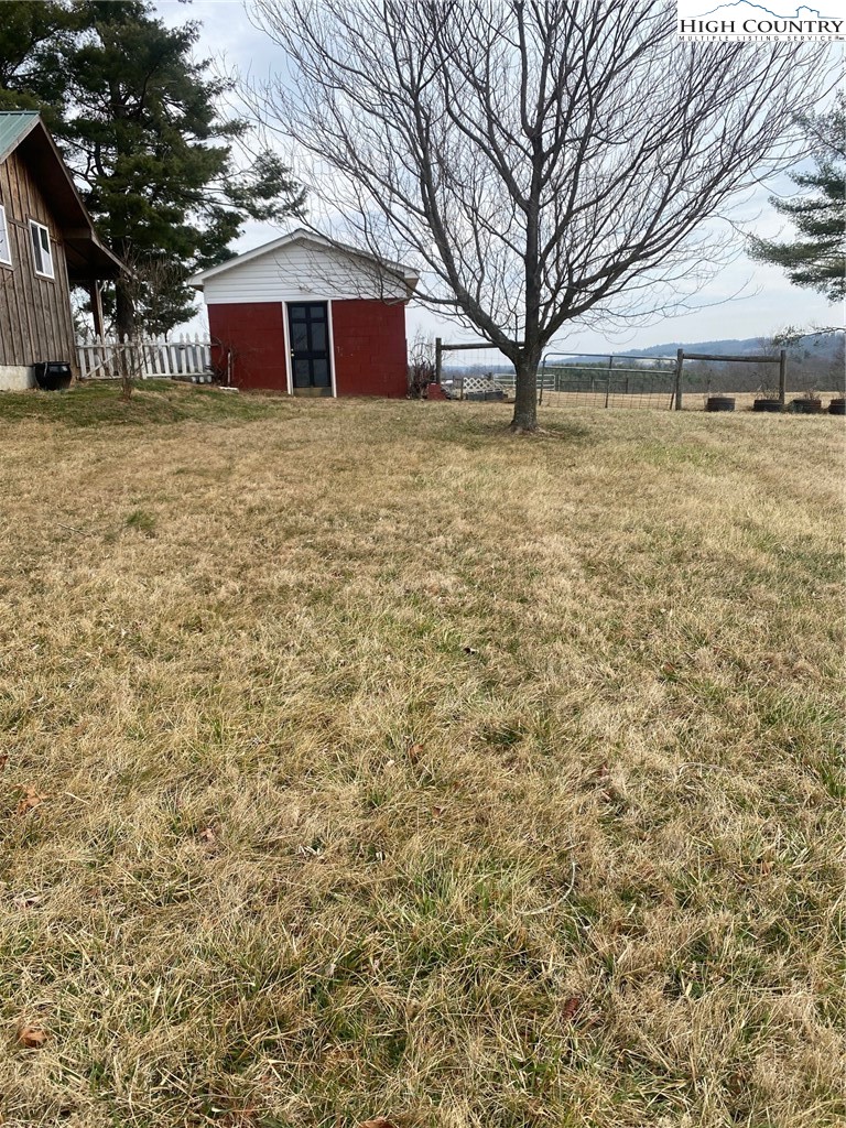 1345 Wagoner Ridge Road Ennice, NC 28623 - Photo 27 of 48 a view of a yard with a house