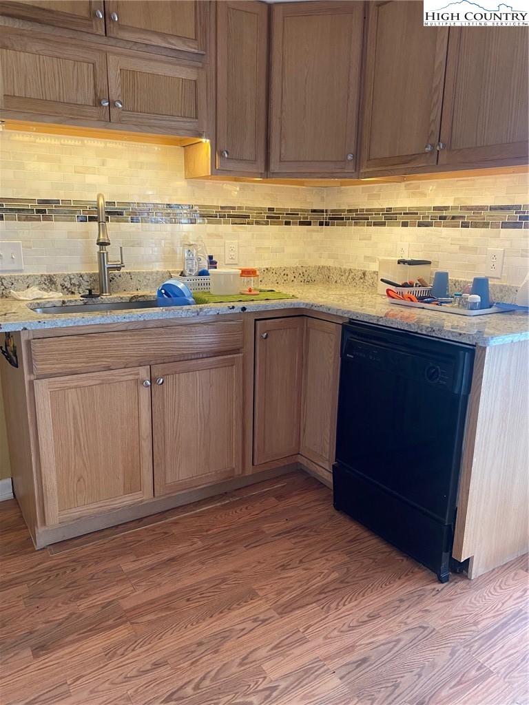 1345 Wagoner Ridge Road Ennice, NC 28623 - Photo 32 of 48 a view of a kitchen with sink and dishwasher