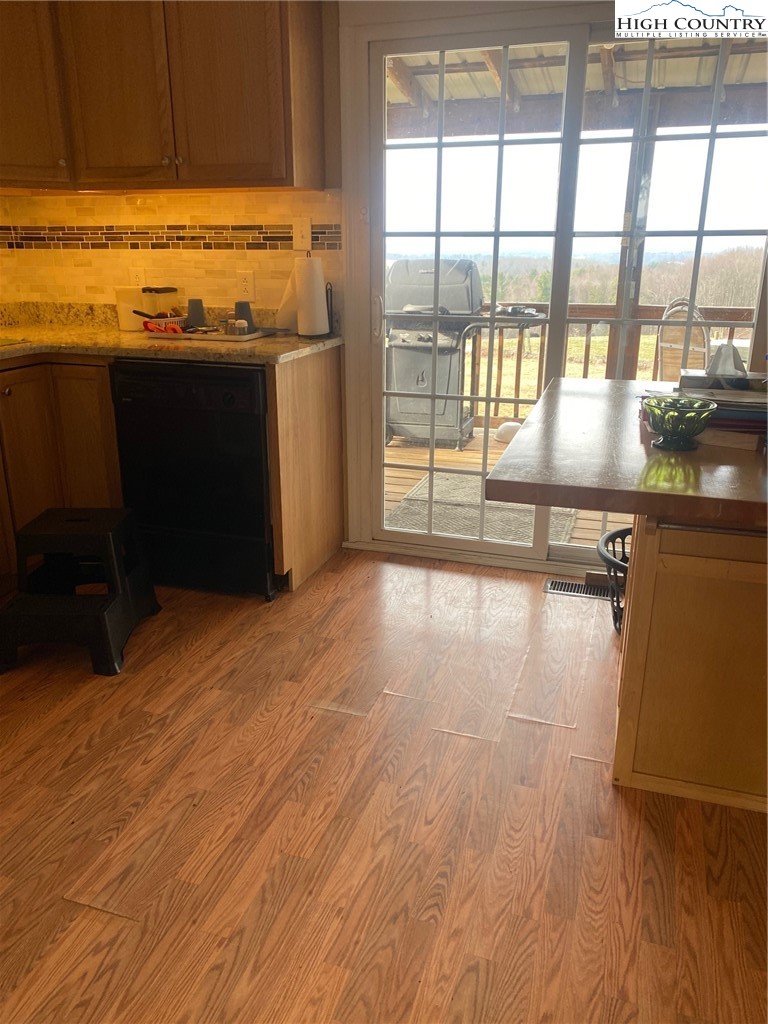 1345 Wagoner Ridge Road Ennice, NC 28623 - Photo 35 of 48 a view of a kitchen with wooden floor
