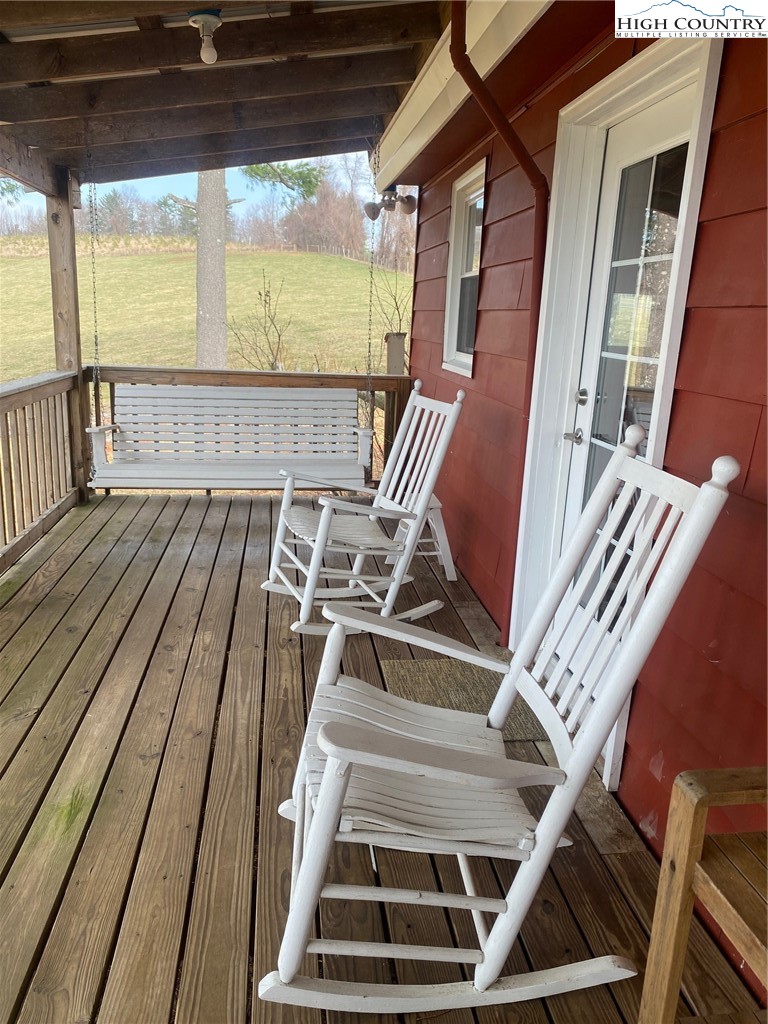 1345 Wagoner Ridge Road Ennice, NC 28623 - Photo 4 of 48 a view of a balcony with chairs