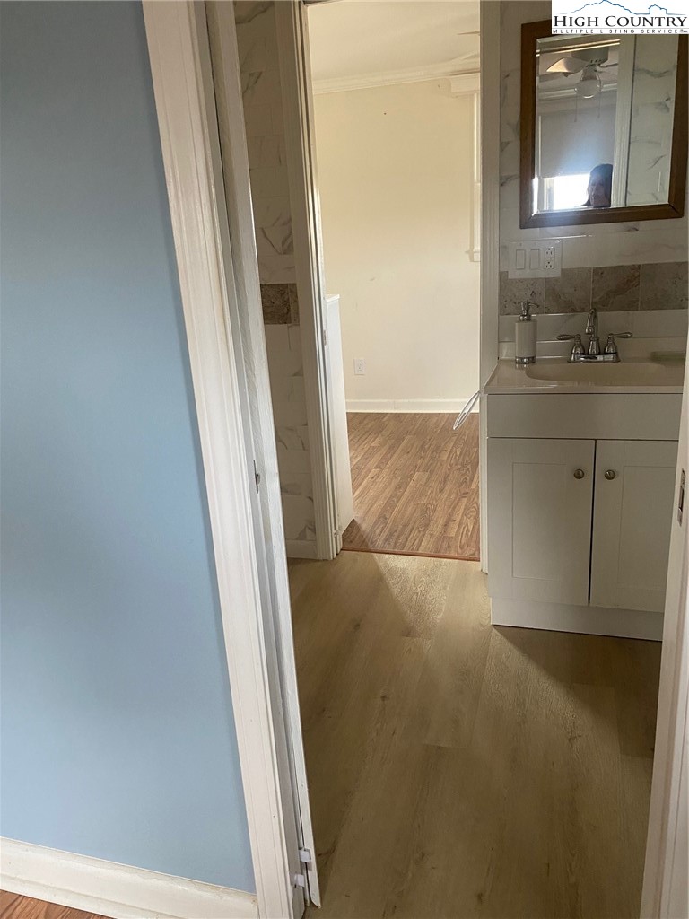 1345 Wagoner Ridge Road Ennice, NC 28623 - Photo 42 of 48 a view of bathroom with a sink and a mirror