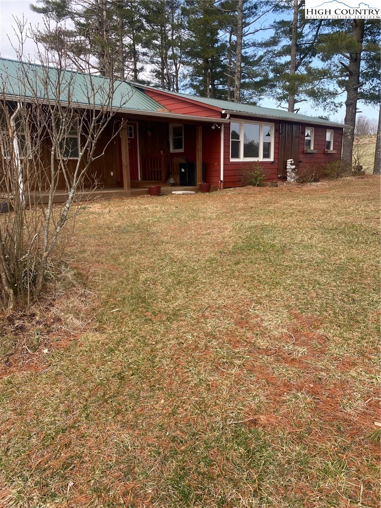 1345 Wagoner Ridge Road Ennice, NC 28623 - Photo 43 of 48 a view of a house with a yard
