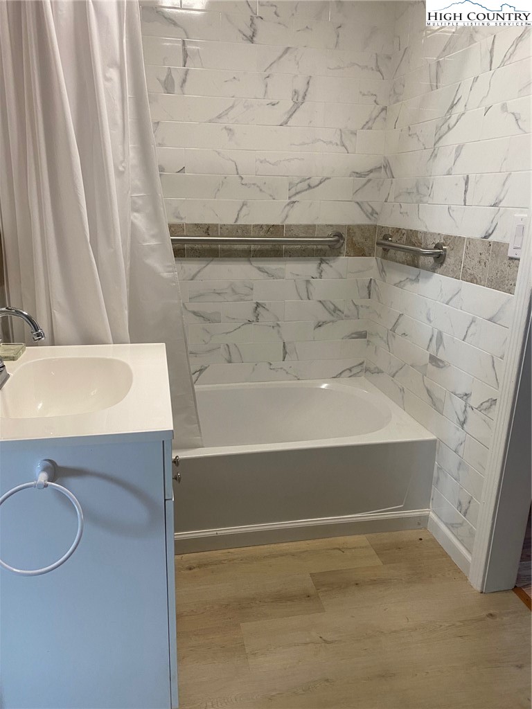 1345 Wagoner Ridge Road Ennice, NC 28623 - Photo 44 of 48 a bathroom with a sink and a bathtub