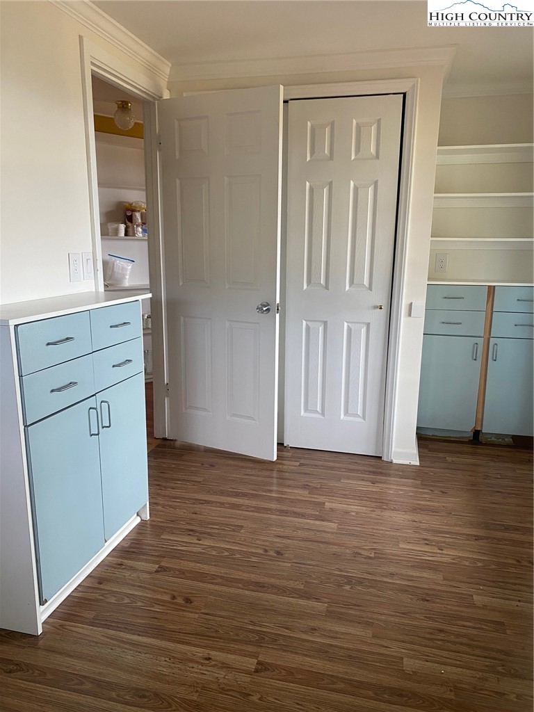 1345 Wagoner Ridge Road Ennice, NC 28623 - Photo 6 of 48 a view of wooden floor and cabinets in a room