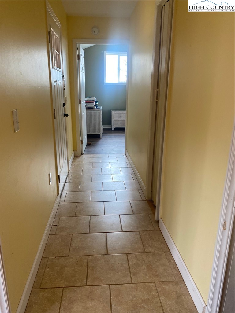 1345 Wagoner Ridge Road Ennice, NC 28623 - Photo 8 of 48 a bathroom with a glass door shower