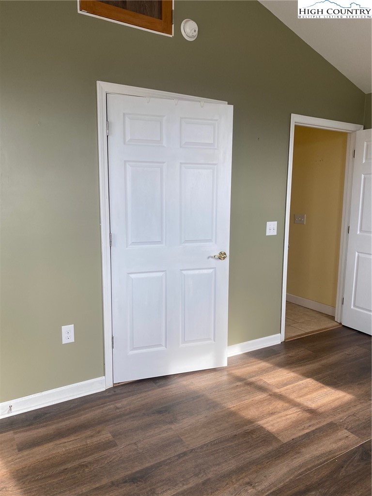 1345 Wagoner Ridge Road Ennice, NC 28623 - Photo 10 of 48 an empty room with wooden floor and closet