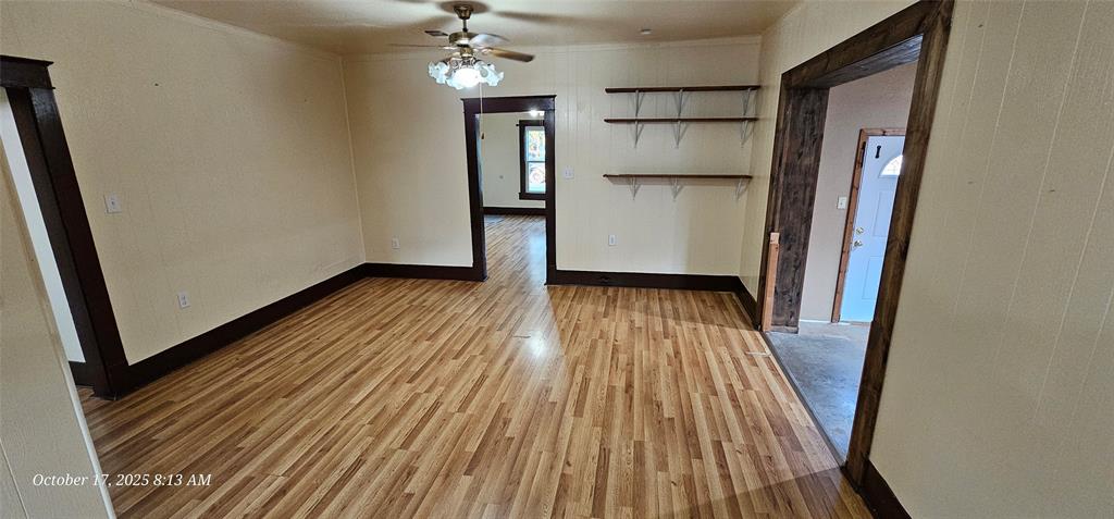 407 Pecan Street Clyde, TX 79510 - Photo 15 of 40 a view of entryway with wooden floor