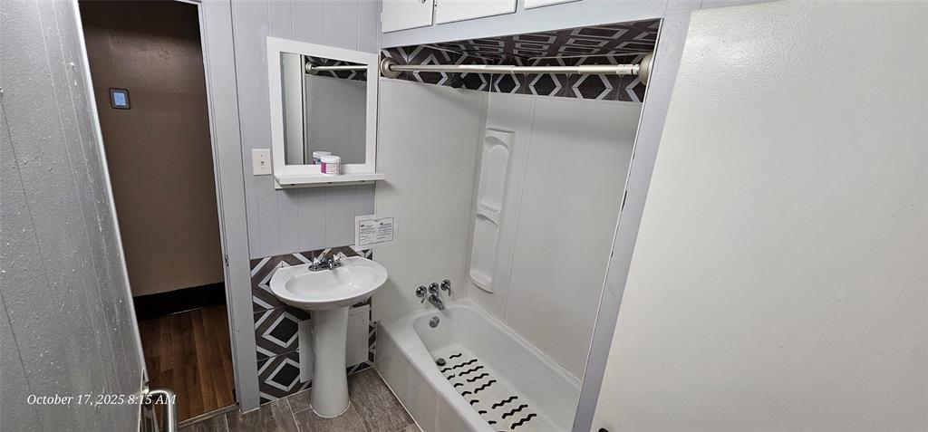 407 Pecan Street Clyde, TX 79510 - Photo 17 of 40 a bathroom with a sink and a mirror