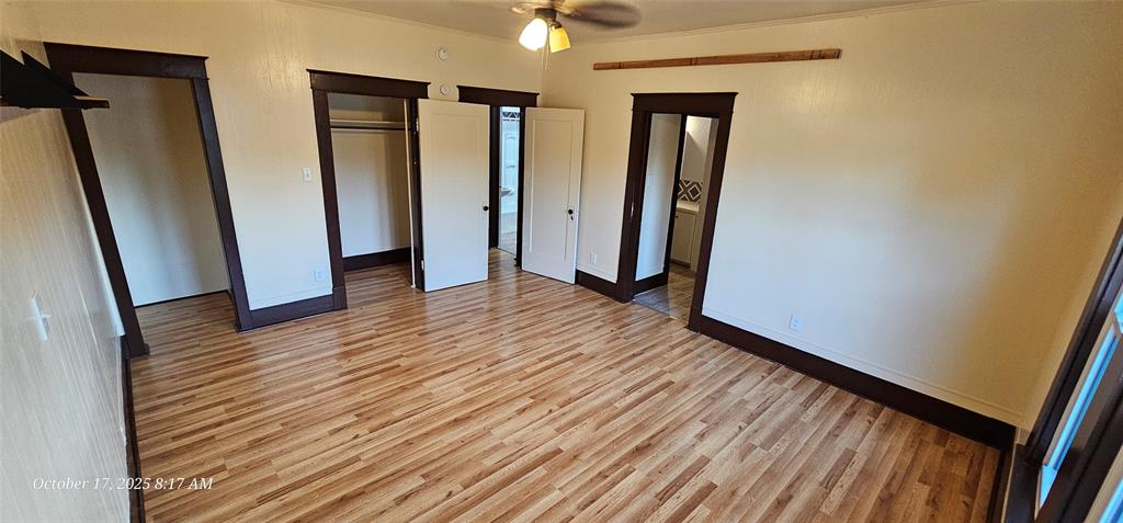 407 Pecan Street Clyde, TX 79510 - Photo 19 of 40 a view of a hallway with wooden floor