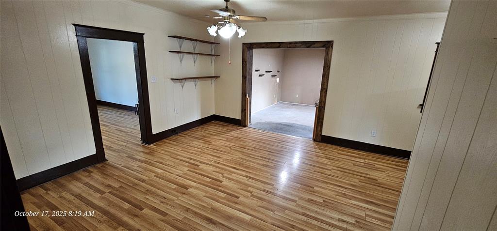 407 Pecan Street Clyde, TX 79510 - Photo 22 of 40 a view of a hallway with wooden floor