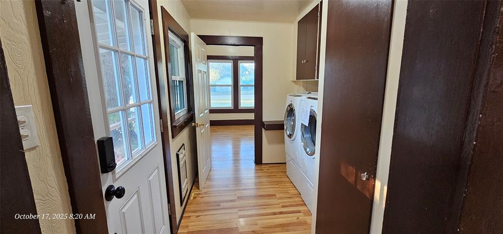 407 Pecan Street Clyde, TX 79510 - Photo 26 of 40 a view of a hallway with wooden floor and staircase