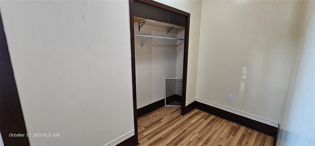 407 Pecan Street Clyde, TX 79510 - Photo 29 of 40 a view of empty room with wooden floor